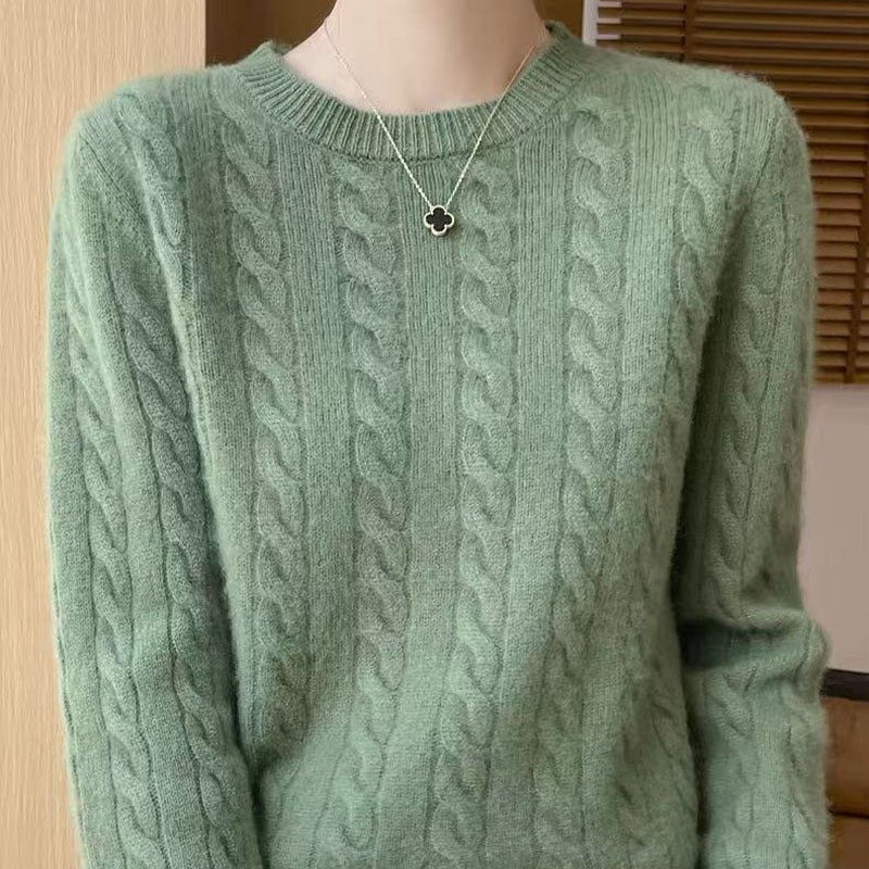 Women's loose cable-knit crewneck sweater in merino wool blend, shown in a relaxed cozy knit style