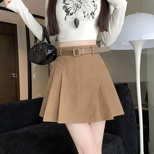 Women's high waist pleated corduroy mini skort with built-in shorts, shown in a relaxed front-facing style