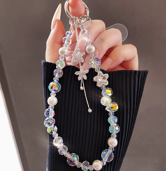 Crystal beaded phone lanyard bracelet with card holder displaying colorful beads, tassel charm, and wrist strap in a flat lay