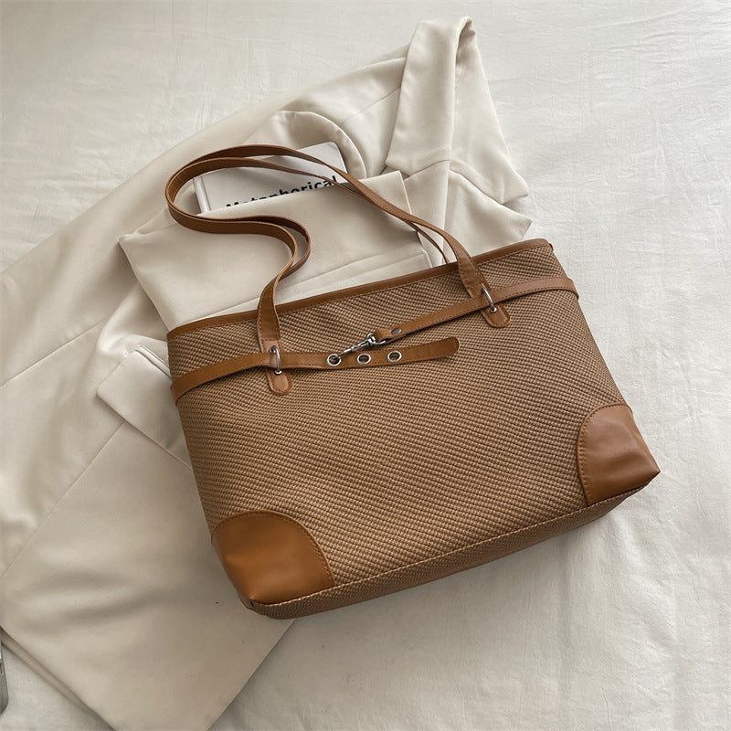 Retro patchwork tote bag with bucket silhouette, shown as a versatile everyday women's shoulder bag