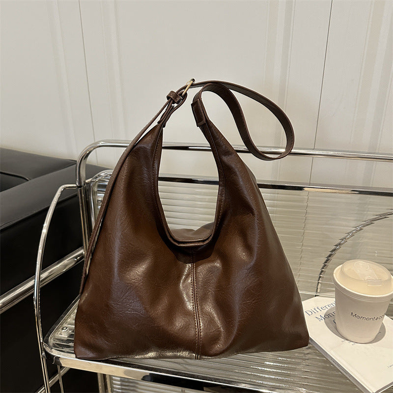 Large-capacity women's PU leather shoulder tote bag in a stylish winter design, ideal as an everyday handbag