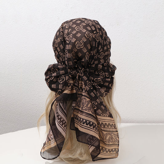 Coffee brown French vintage geometric woven shawl scarf draped as a wrap, featuring a retro pattern