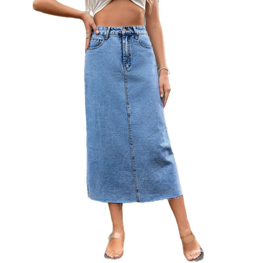 Women's high-waisted A-line denim skirt in dark blue, shown from the side to highlight the flared silhouette and waistband fi