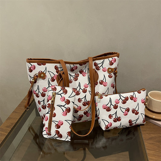 Women's large capacity tote bag with underarm strap, shown in a neutral tone with structured silhouette and dual carry option