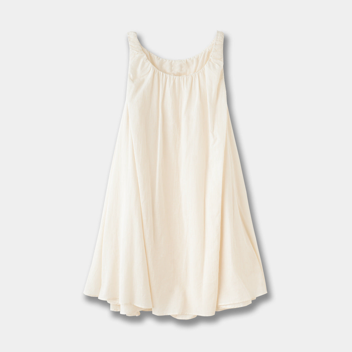 Sleeveless pleated suspender midi dress in beige cotton showing back strap detail and flowing skirt in mori style