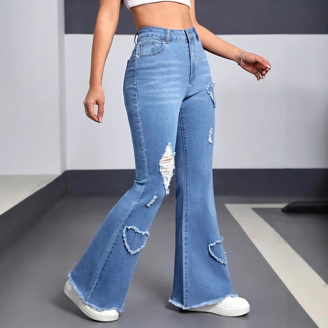Women wearing high waist flared denim jeans with embroidery and ripped details, styled for a casual everyday look