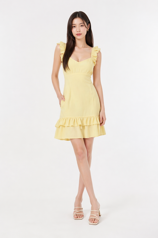 Woman wearing a sleeveless slim-fit midi dress with a V-neckline and ruffle hem, styled for a casual yet elegant everyday look