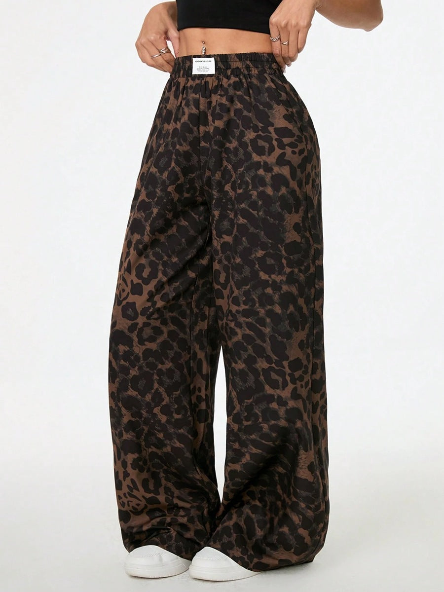 Woman wearing leopard print wide leg pants with elastic waistband in a relaxed, stylish everyday outfit