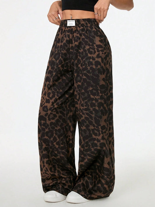Woman wearing leopard print wide leg pants with elastic waistband in a relaxed, stylish everyday outfit