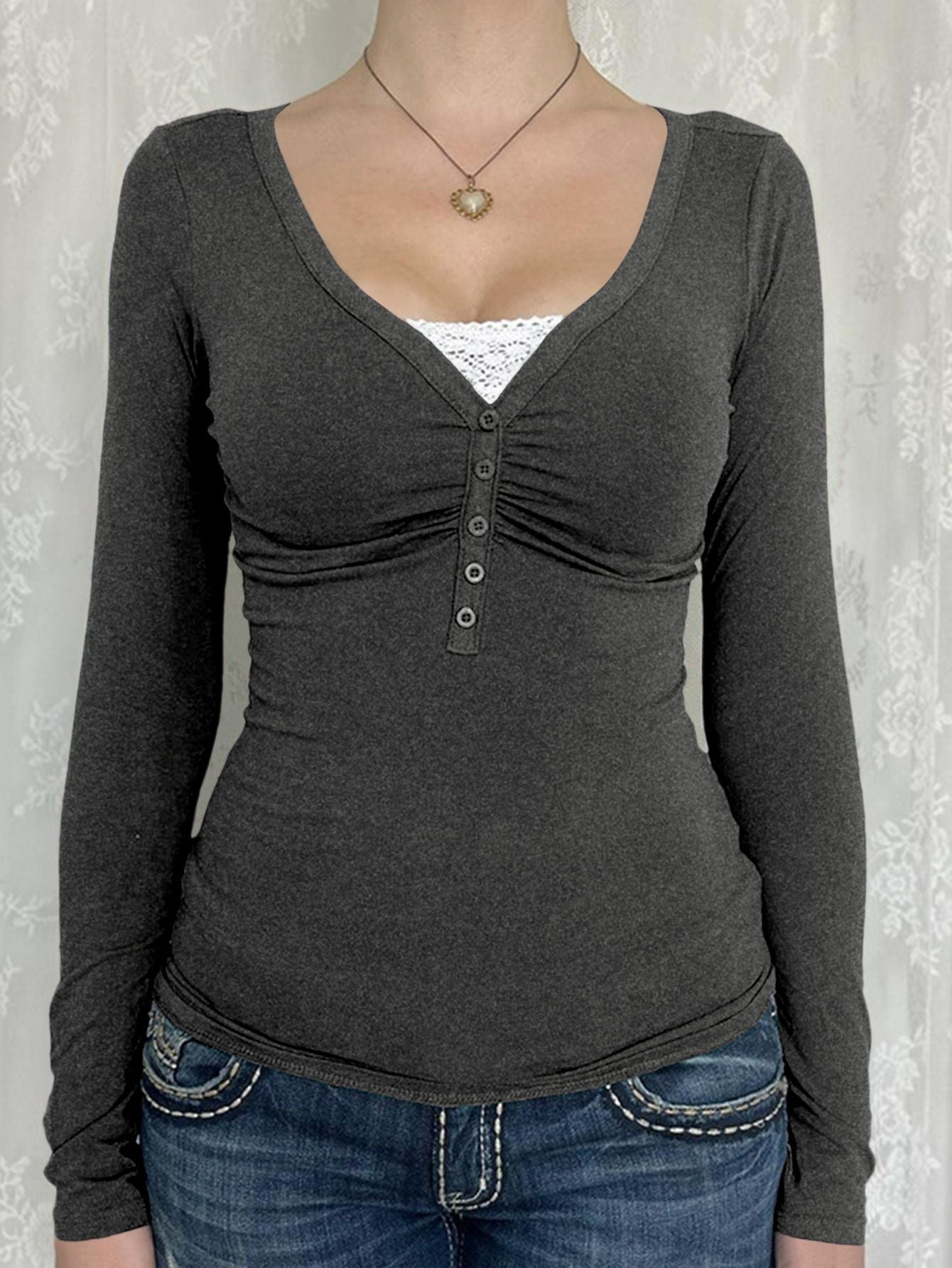 Women's slim fit button knit cardigan with long sleeves in a solid color, shown from the side to highlight the stretchy ribbe