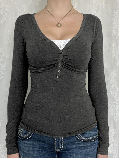 Women's slim fit button knit cardigan with long sleeves in a solid color, shown from the side to highlight the stretchy ribbe