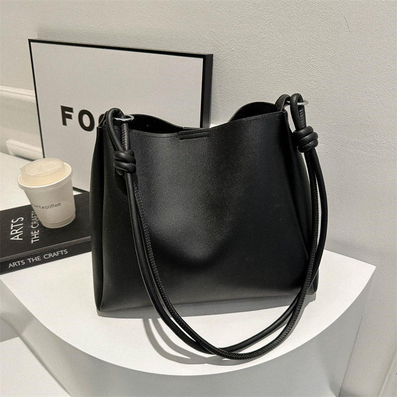 Women's PU leather retro bucket crossbody tote bag in a structured silhouette, ideal as a stylish commuter purse