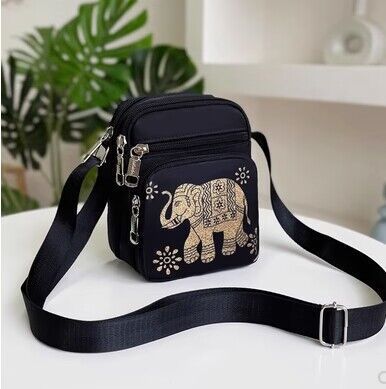 Women's waterproof casual shoulder bag shown from the side, highlighting its compact shape and durable exterior for everyday 