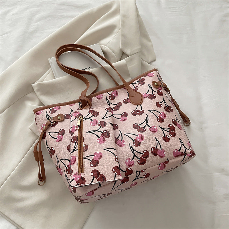 Spacious women's tote bag with underarm strap shown from the side, highlighting its large capacity and structured silhouette