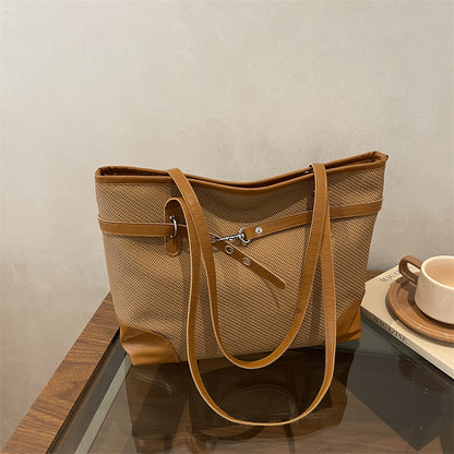 Retro patchwork tote bag with bucket silhouette, shown as a versatile everyday women's shoulder bag