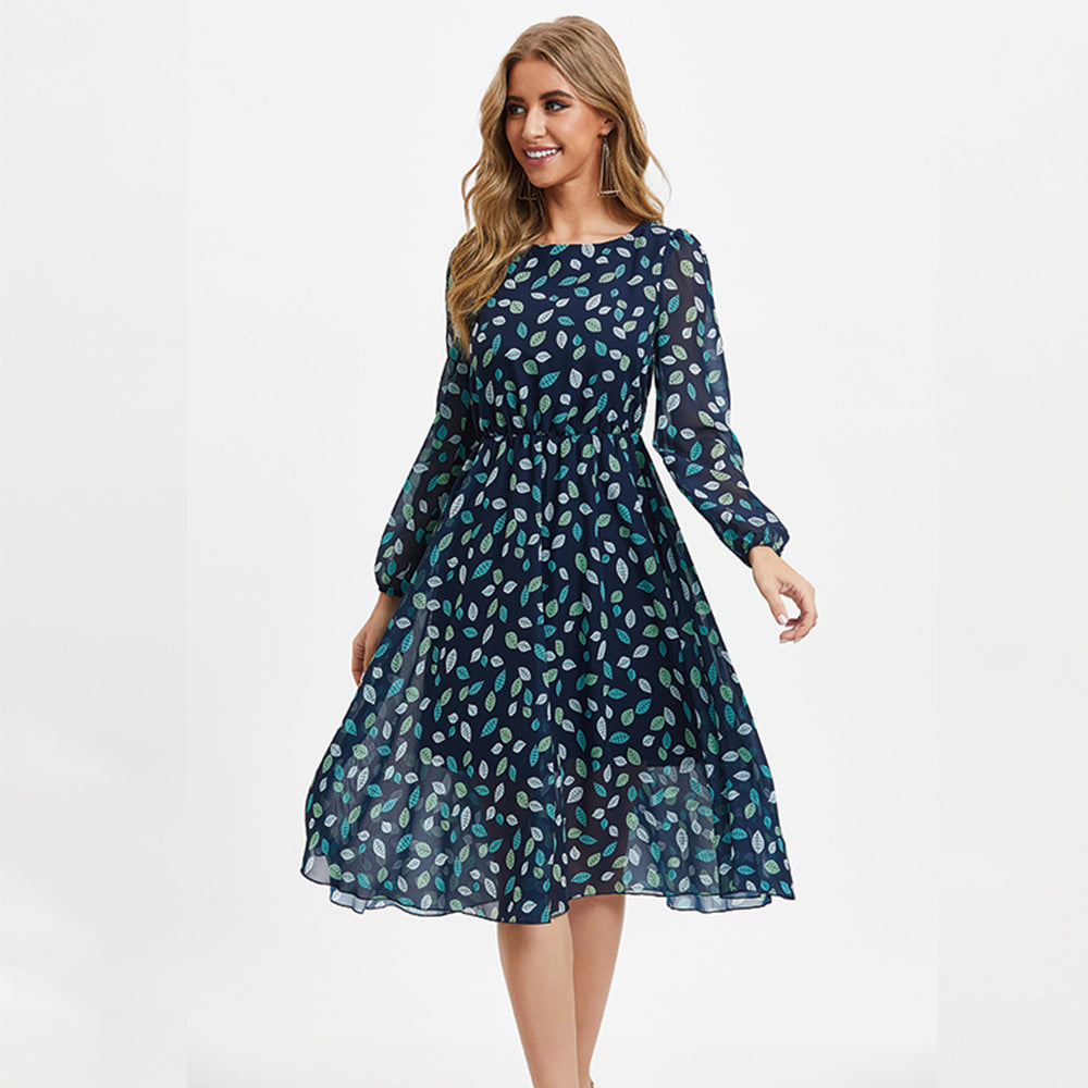 Floral print long sleeve midi dress with high waist and A-line silhouette, shown in full length front view