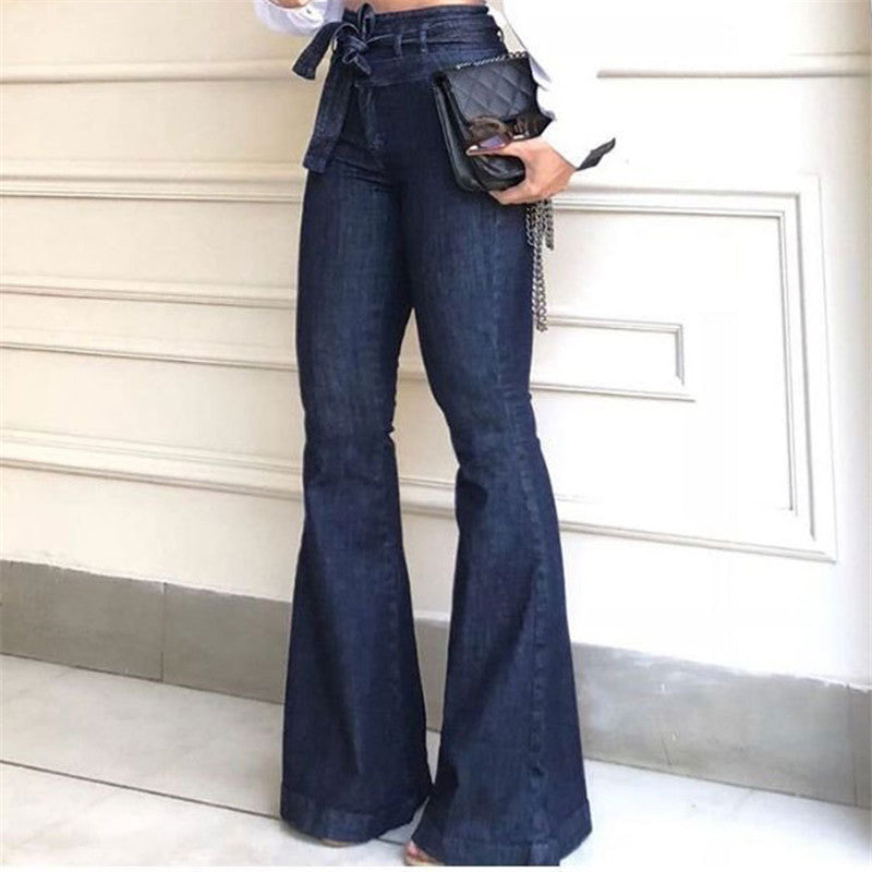 High waist wide leg denim pants with lace-up detail, shown from the side to highlight the flared silhouette