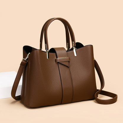 Retro bucket handbag with removable crossbody strap shown from the side, highlighting its structured silhouette and vintage-i