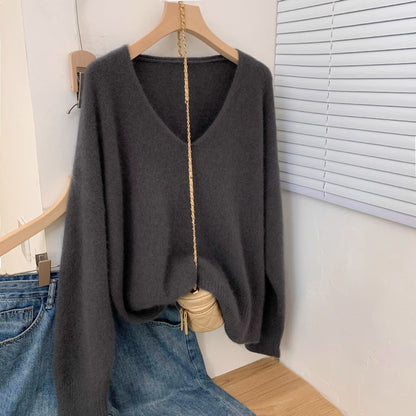 Women's loose fit v-neck pullover sweater with crochet lace trim, displayed in a relaxed everyday style