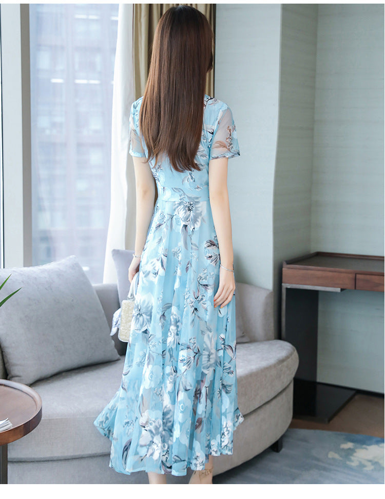 Plus size floral print v-neck midi dress with short sleeves, shown in a colorful summer floral pattern
