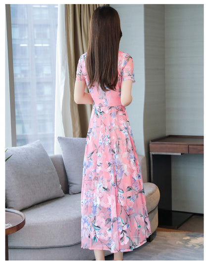 Plus size floral print v-neck midi dress with short sleeves, shown from the back in a breezy summer style