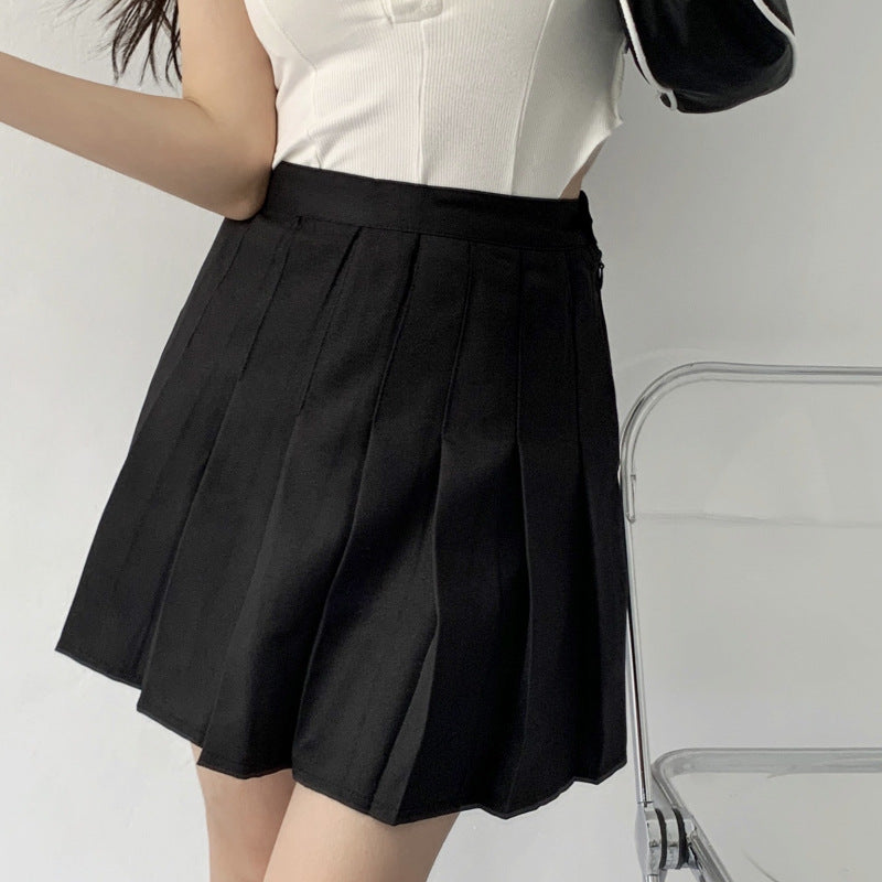 High waist pleated mini skirt with A-line flared silhouette, shown in a close-up detail view