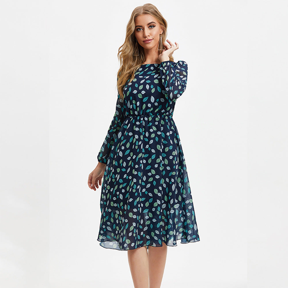 Floral print long sleeve midi dress with high waist and A-line skirt, shown from the back in a soft floral pattern