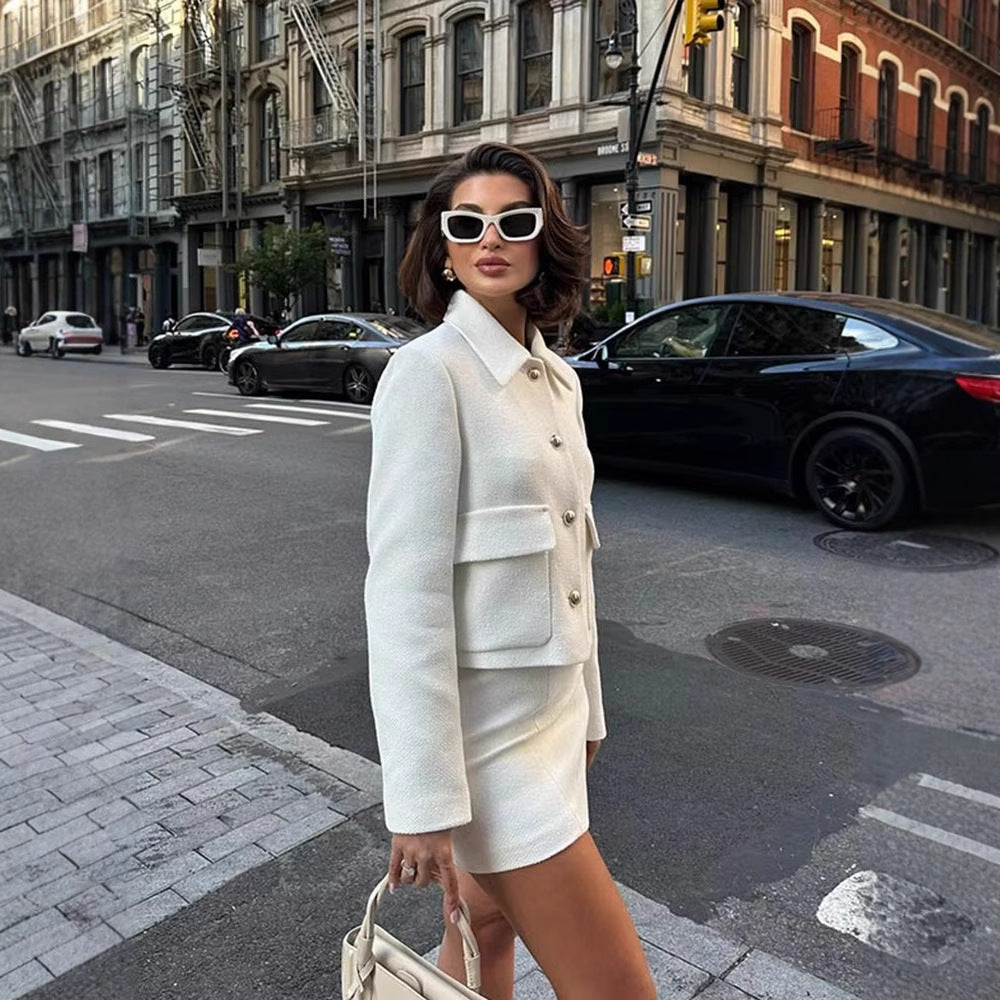 Women's tweed two-piece suit set with tailored coat and matching skirt in a classic woven fabric
