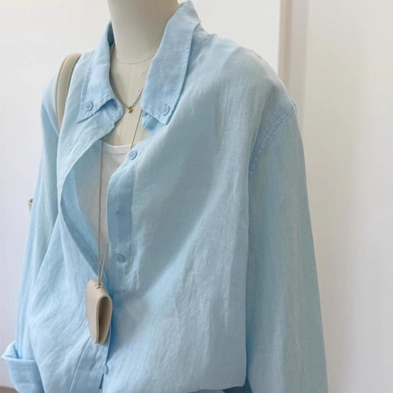 Light blue loose linen long sleeve shirt for women, shown in a relaxed casual fit with breathable fabric detail