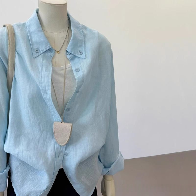 Light blue loose linen casual shirt for women, showing relaxed long sleeve silhouette and breathable fabric texture