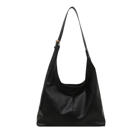 Large-capacity PU leather women's shoulder tote bag in a neutral tone, perfect for winter everyday carry.
