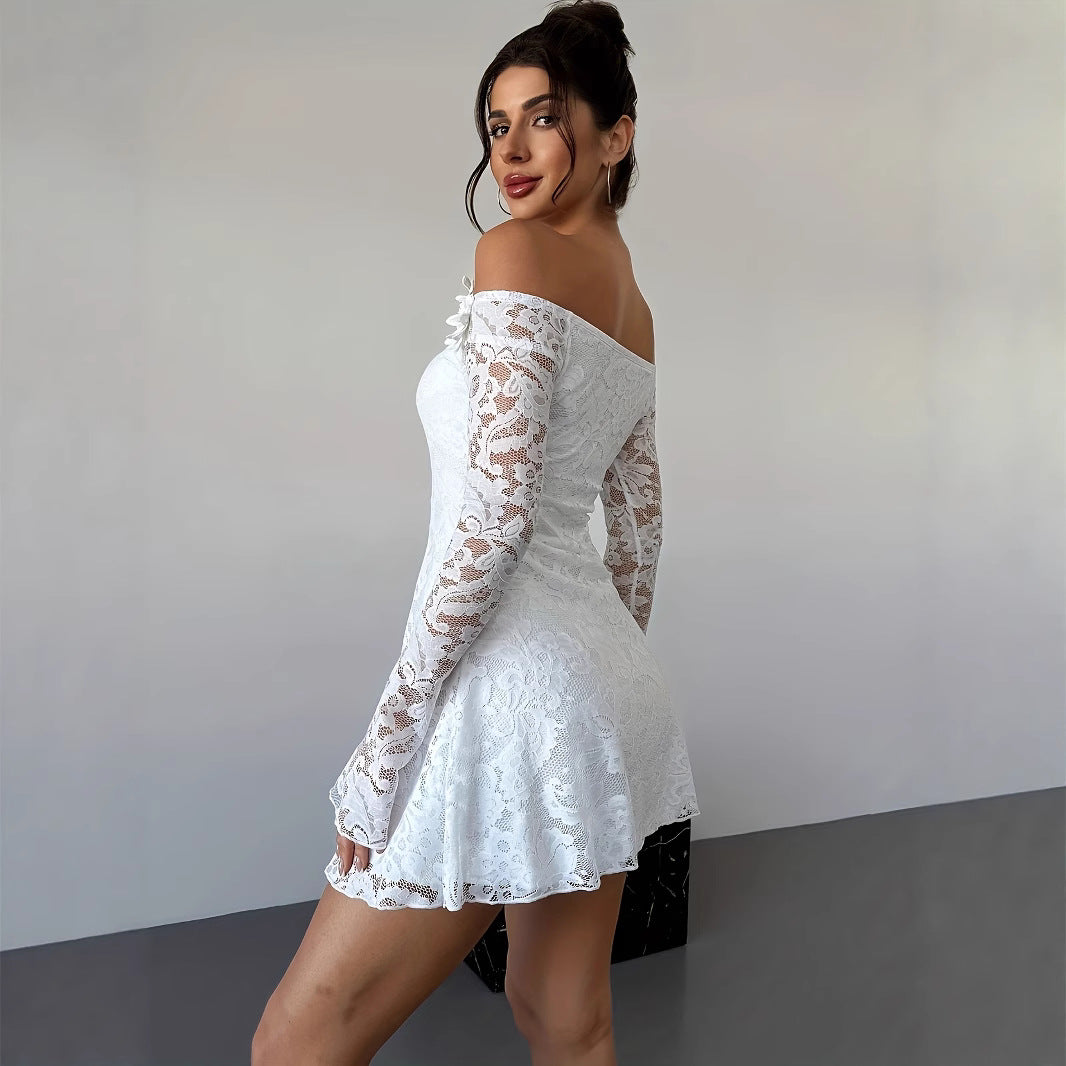 White off-shoulder lace mini bodycon dress with fitted silhouette, shown in a close-up detail view highlighting the lace text