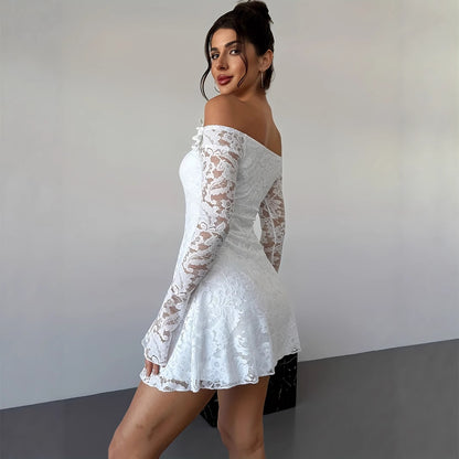 White off-shoulder lace mini bodycon dress with fitted silhouette, shown in a close-up detail view highlighting the lace text