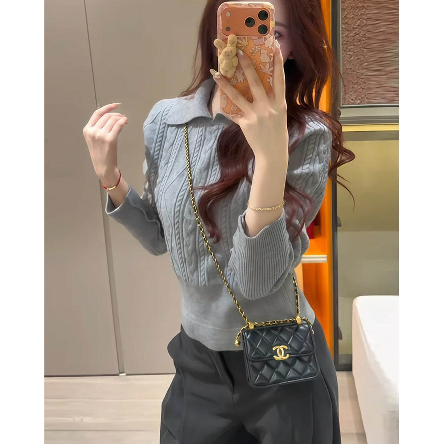 Women's mock neck slim fit knit sweater in a cozy pullover style, shown from the front on a model