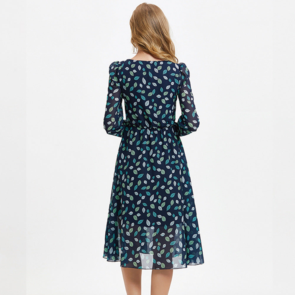 Floral print long sleeve midi dress with high waist and A-line silhouette, shown from the side