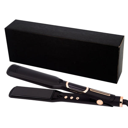 Negative ion flat iron gliding through dark hair, showing smooth and shiny straightened results
