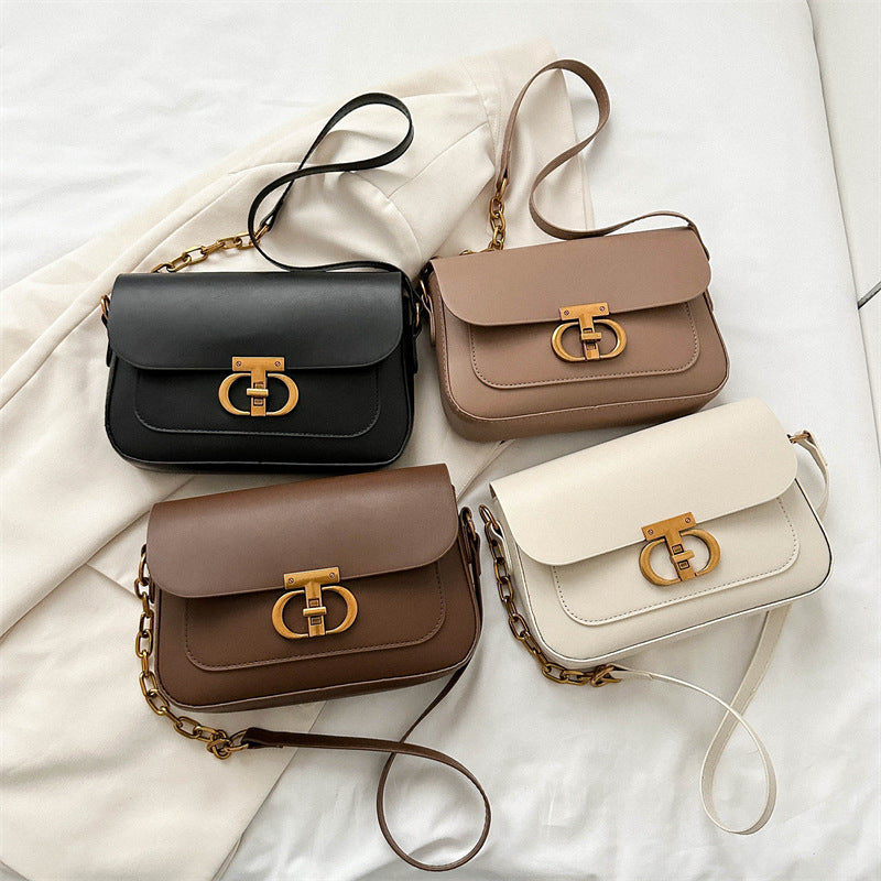 Korean-style women's shoulder bag in structured PU leather with a minimalist design, shown as a versatile everyday handbag.