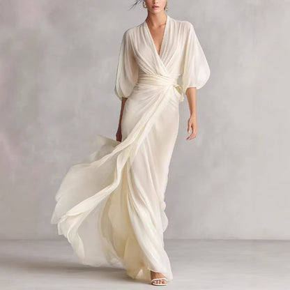 Women's slim-fit A-line long dress in a classic silhouette, styled as elegant office wear for a polished everyday look.