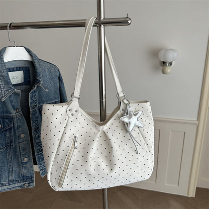 Spacious canvas tote shoulder bag for women shown from the side, highlighting its large capacity and sturdy handles.