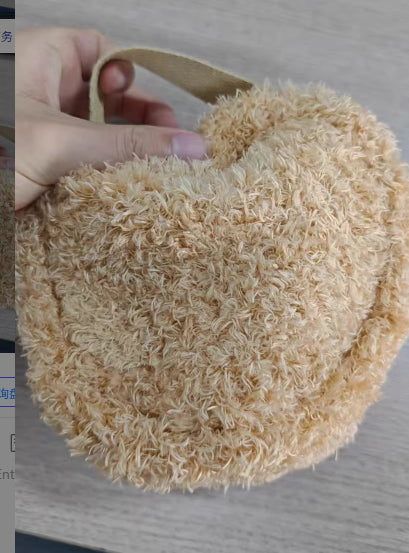 Cute oval lambswool cosmetic pouch with 3D bear head detail, shown from the side to highlight its fluffy plush texture
