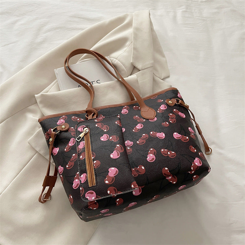 Spacious women's tote bag with underarm strap shown from a side angle, highlighting its large capacity design