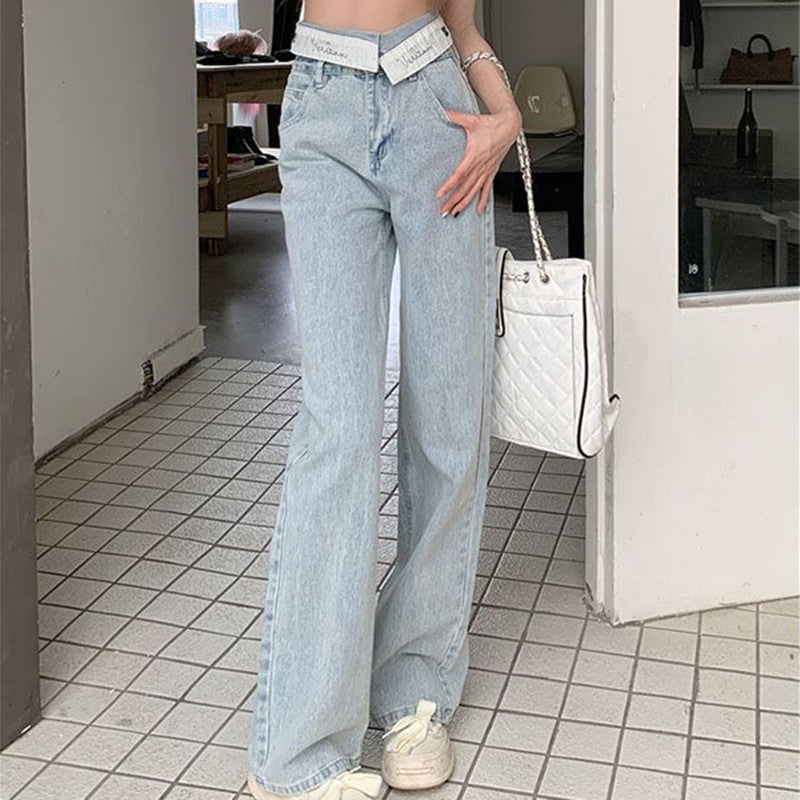 Women's high waist wide leg jeans with a folded waistband, shown in a relaxed denim silhouette
