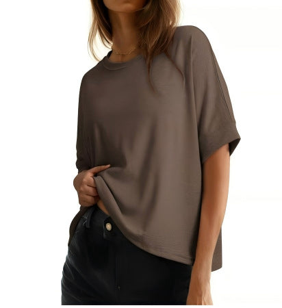 Women's batwing sleeve cotton casual top in a loose fit style, side view showing relaxed drape and round neckline