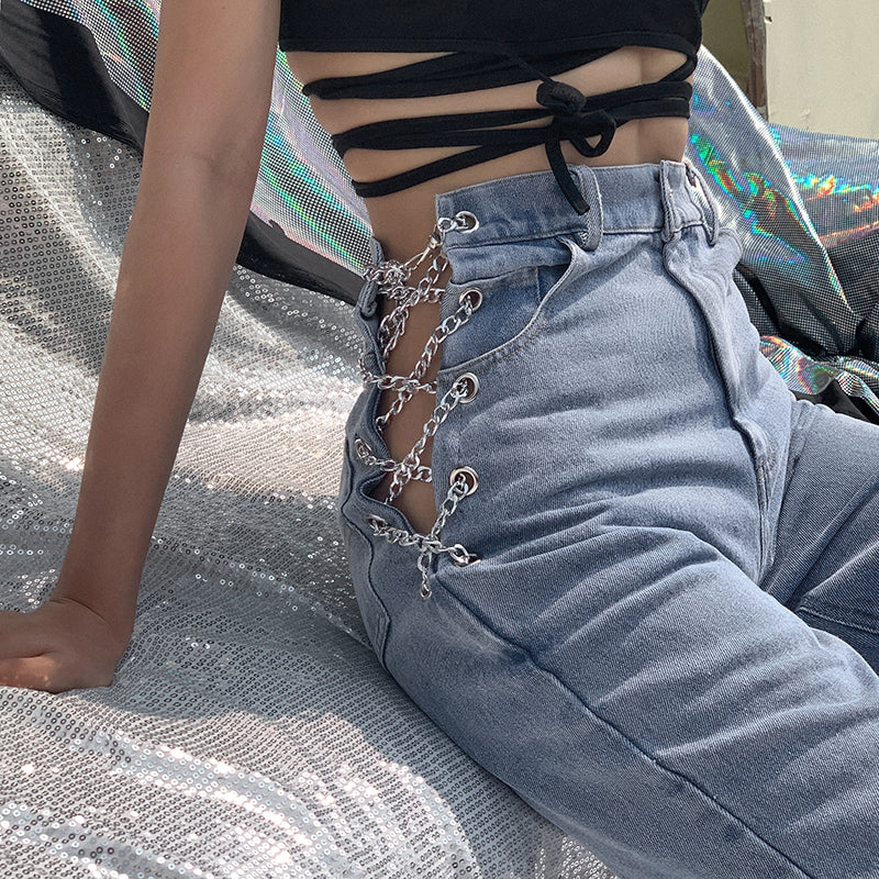 Women's high waist straight leg jeans with silver chain detail at the waist, shown in a close-up side view