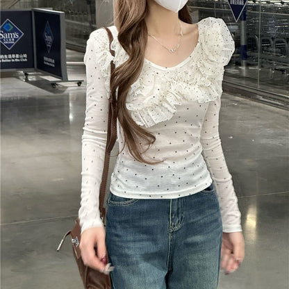 Women's slim-fit long sleeve blouse with polka dot lace detailing, shown in a close-up style view