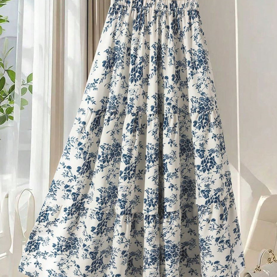 Women's high-waisted floral print midi skirt with a flared A-line silhouette, shown in a close-up detail view.