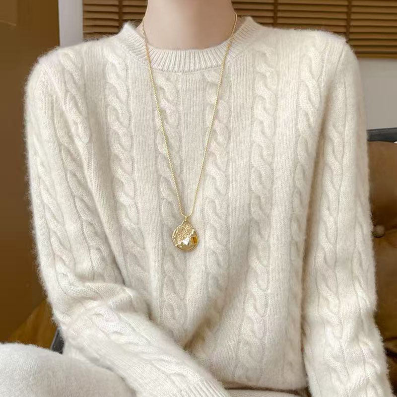 Women's loose cable-knit crewneck sweater in merino wool blend, shown in a relaxed cozy knit style