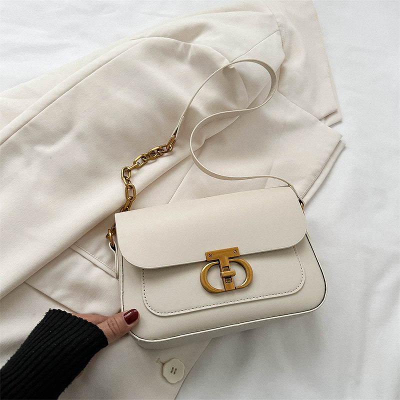 Korean-style women's shoulder bag in a neutral tone, featuring a structured silhouette and minimalist design for everyday wea