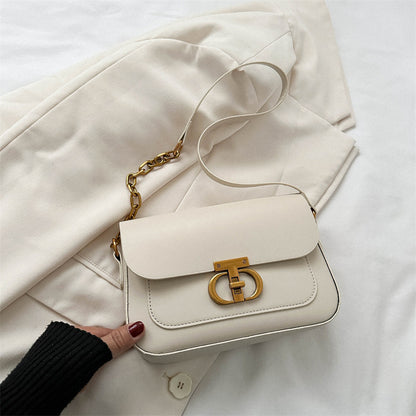Korean-style women's shoulder bag in a neutral tone, featuring a structured silhouette and minimalist design for everyday wea