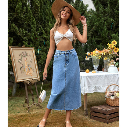 Women's dark blue high-waisted A-line denim skirt shown from the side, highlighting the flared silhouette and waistband detai